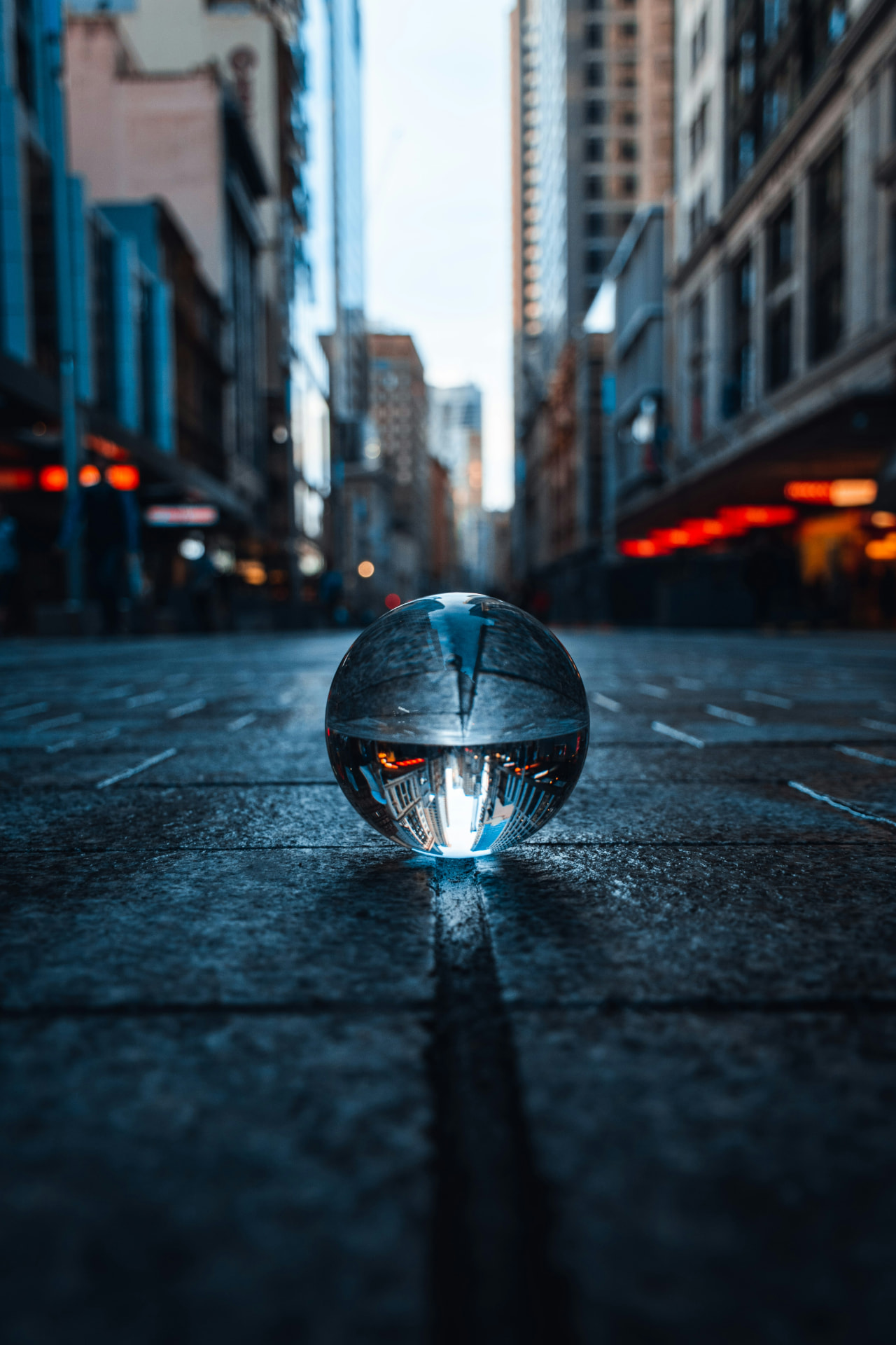 Glass sphere bringing a city street into focus