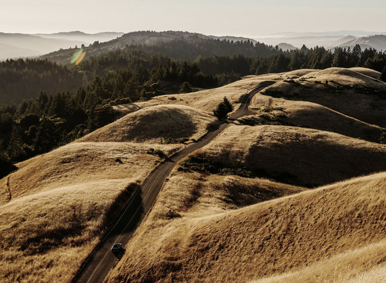 Winding road through golden hills